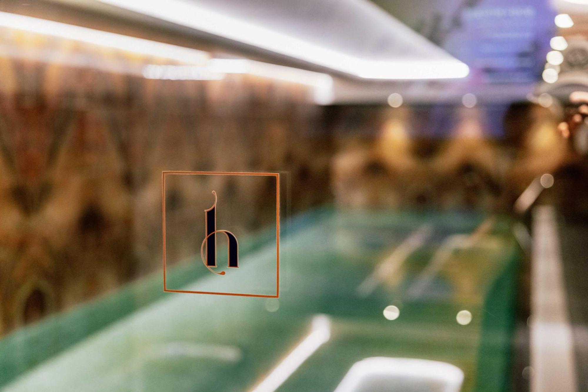 Grand Poet Hotel And Spa By Semarah Riga Exterior foto The logo of the hotel